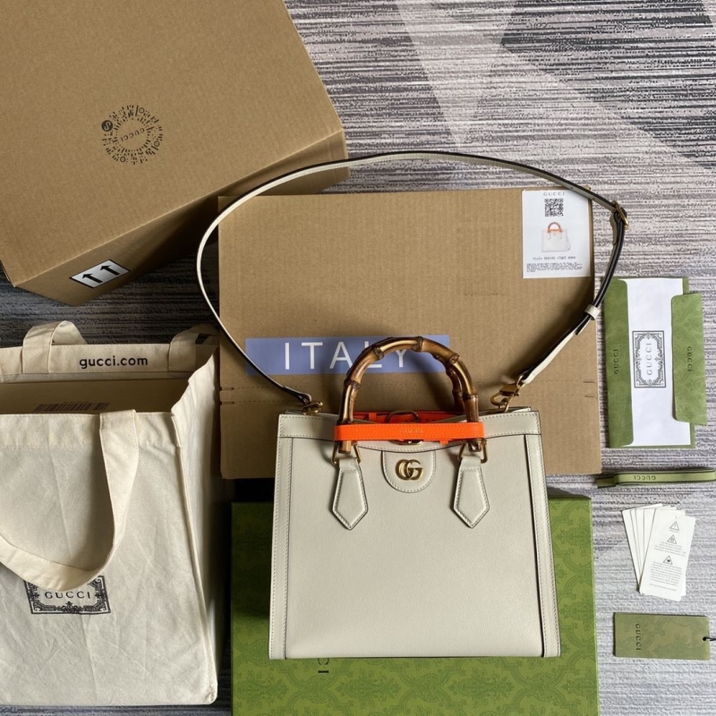 G*u*i top handle bags